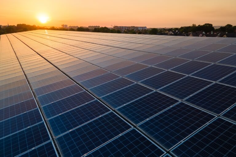 Blue,Photovoltaic,Solar,Panels,Mounted,On,Building,Roof,For,Producing